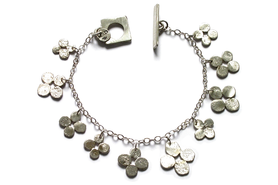 silver bloom charm bracelet   $250.00   item 04-464 