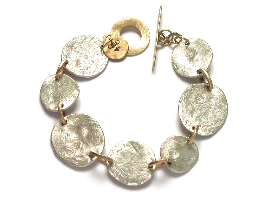 silver disc & gold link bracelet   $640.00   item 07-211 
